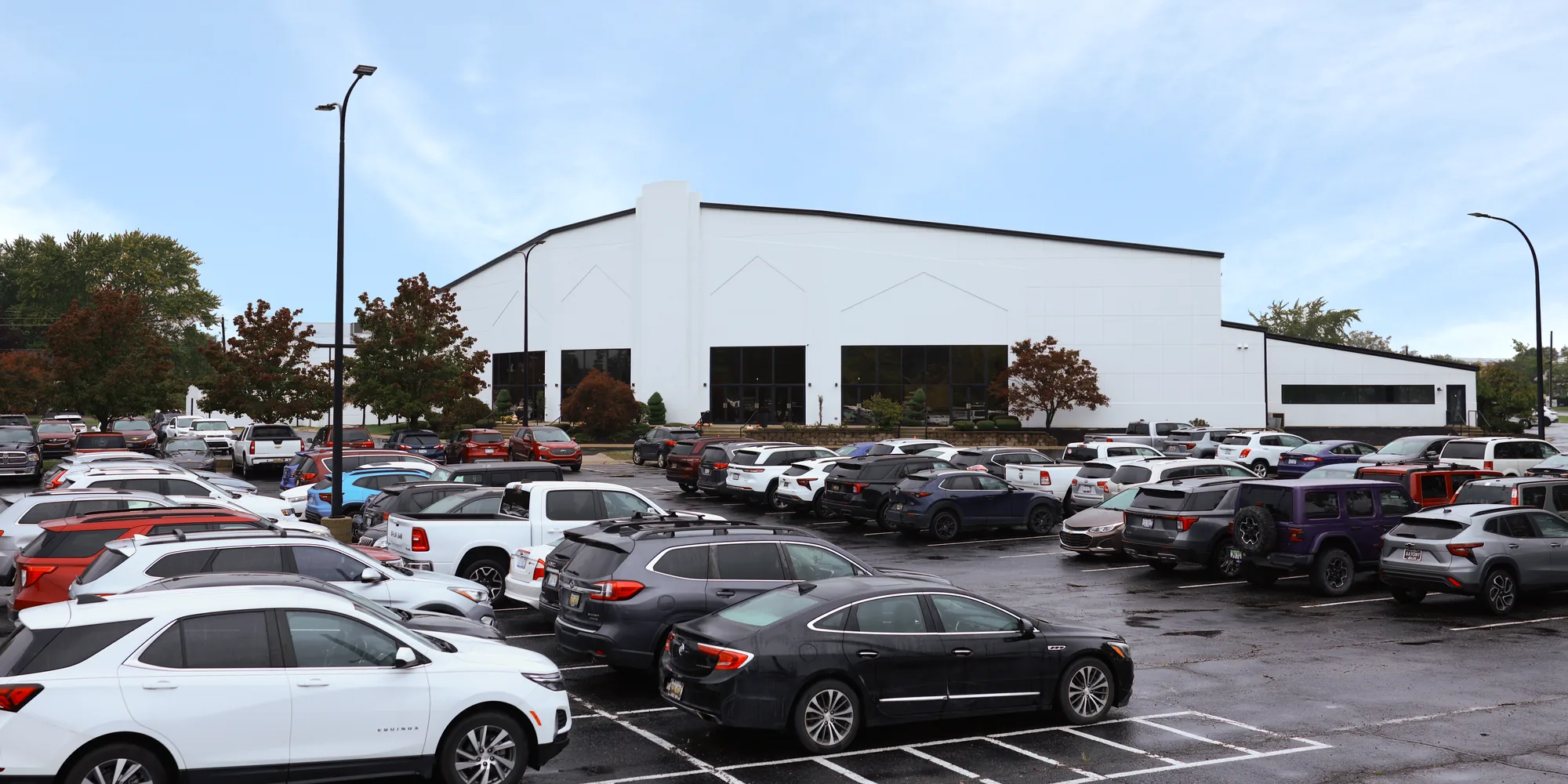 The front of Stewart Road Church from the parking lot, with the main lobby doors in the center