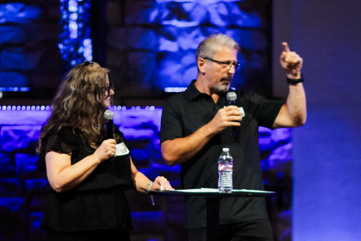 Recovery Alive leaders teaching from the stage