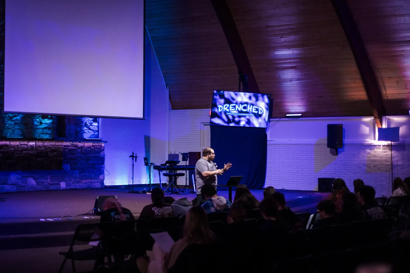 Students listening to teaching in the youth room